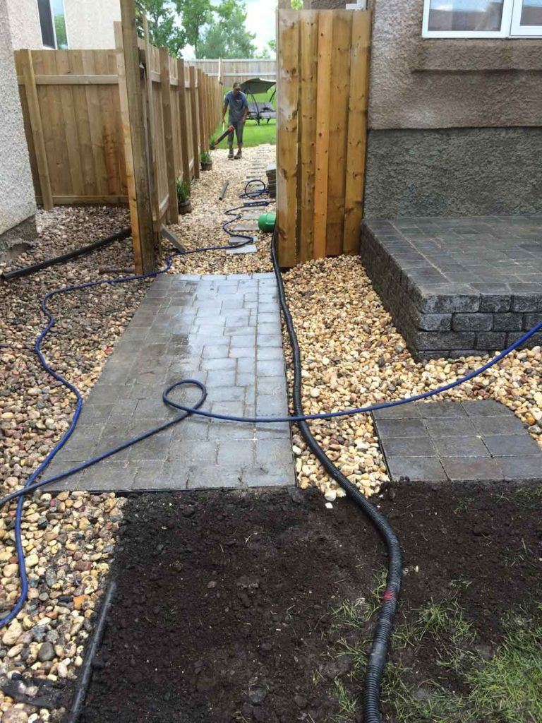custom stone interlock back yard in progress