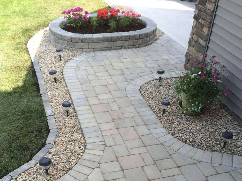 custom interlock stone walkway and stone flower planter
