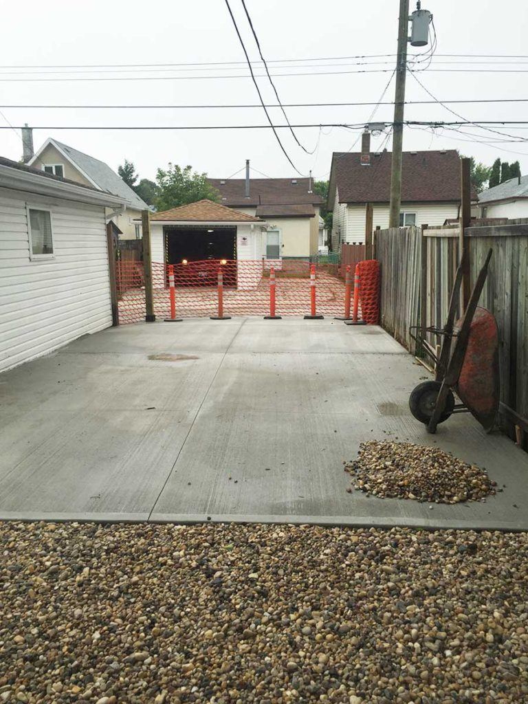 a concrete backyard installation in progress
