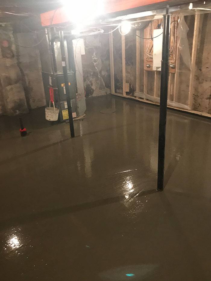 a newly poured concrete basement floor