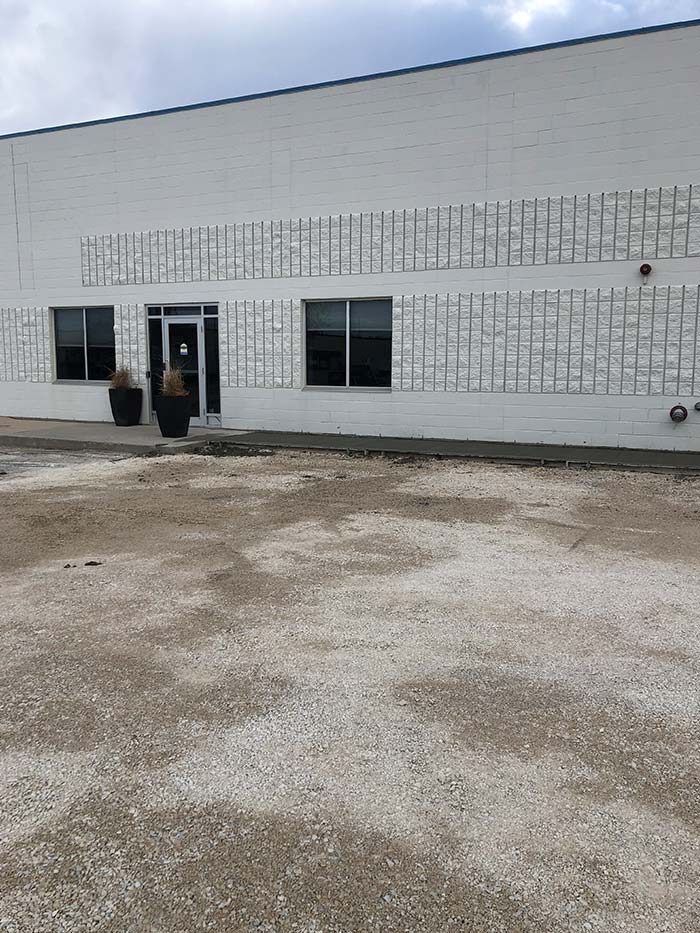 white and gray concrete commercial building